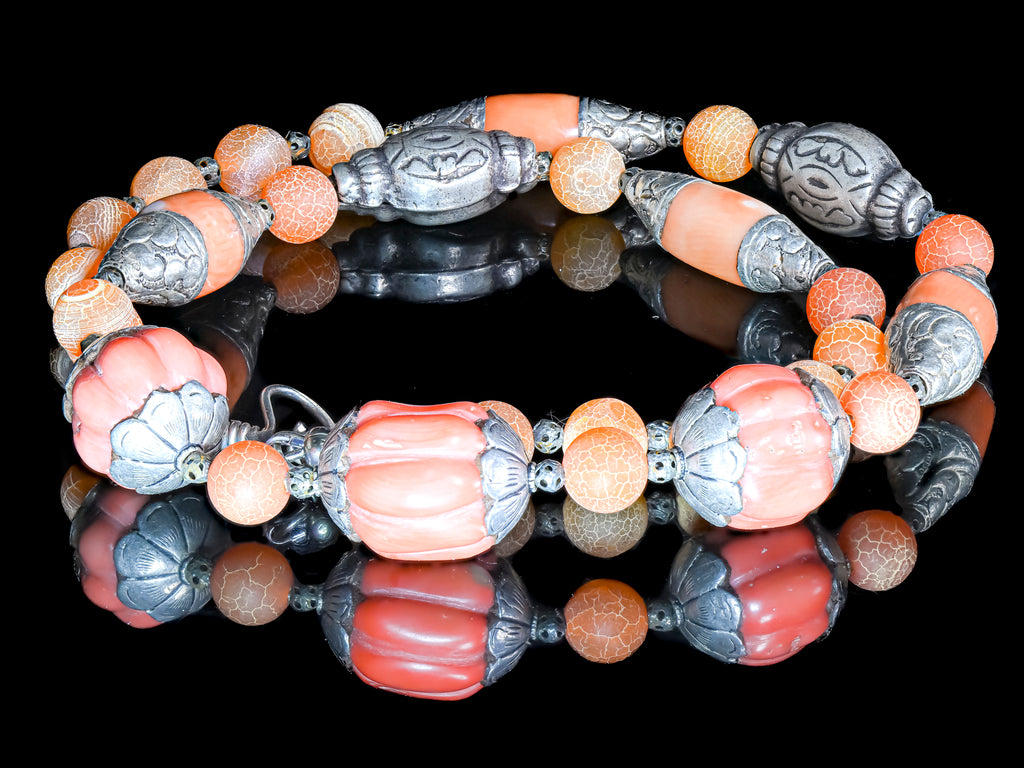 A Necklace of Tibetan Capped Faux Coral Beads, Old Coin Silver from India, and Crackled Agate