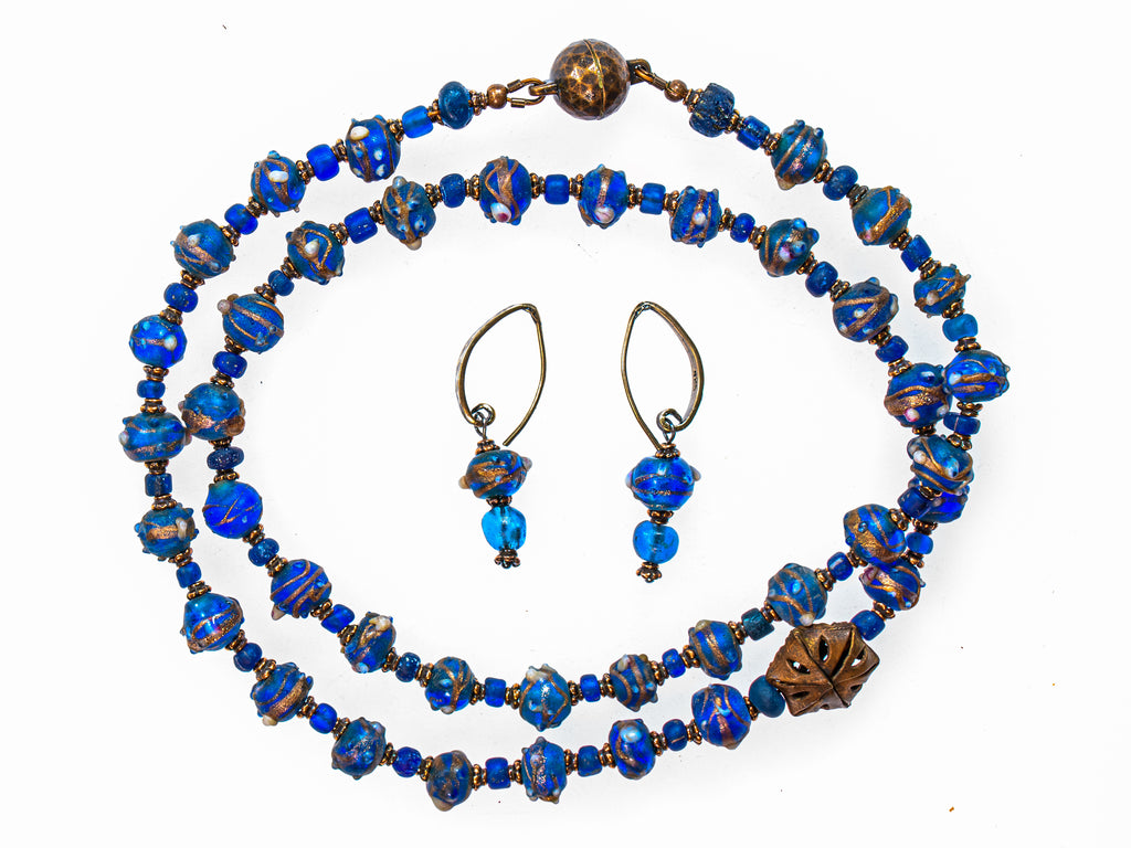 A Short Necklace of Translucent Blue and Gold Antique Glass and Antique Octagon Brass Beads With Matching Earrings