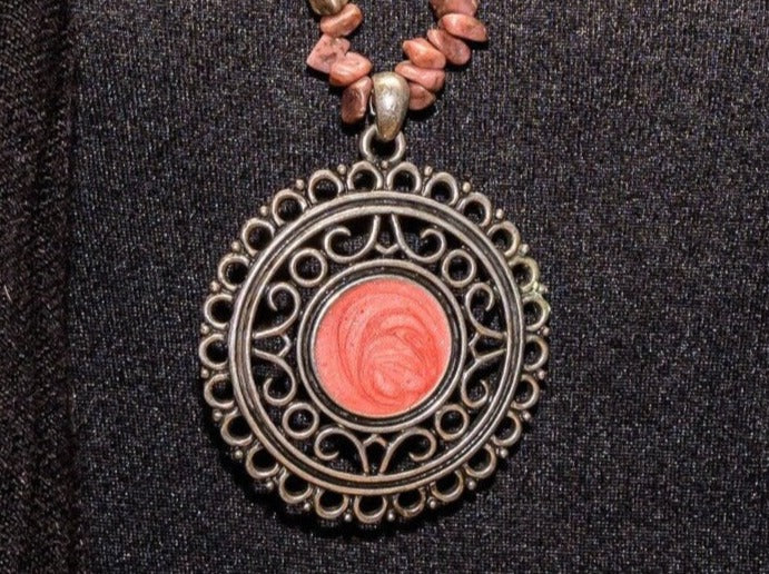 Rhodochrosite chip necklace with round sterling silver and pink coral-colored inlay