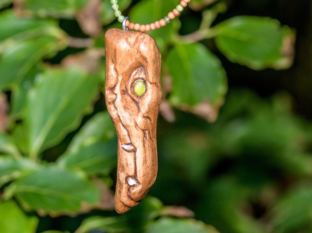 Hand Carved Wood Spirit Dragon Monster Pendant on a wood and green jade necklace