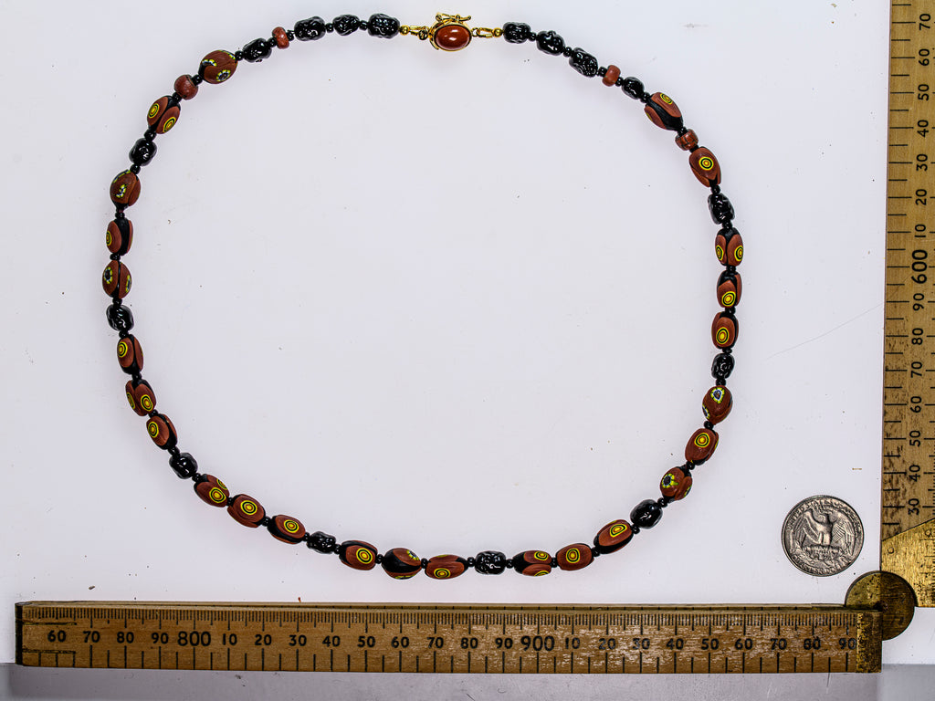 A Necklace of Vintage Brick Red Eye and Black  Murano Glass Beads