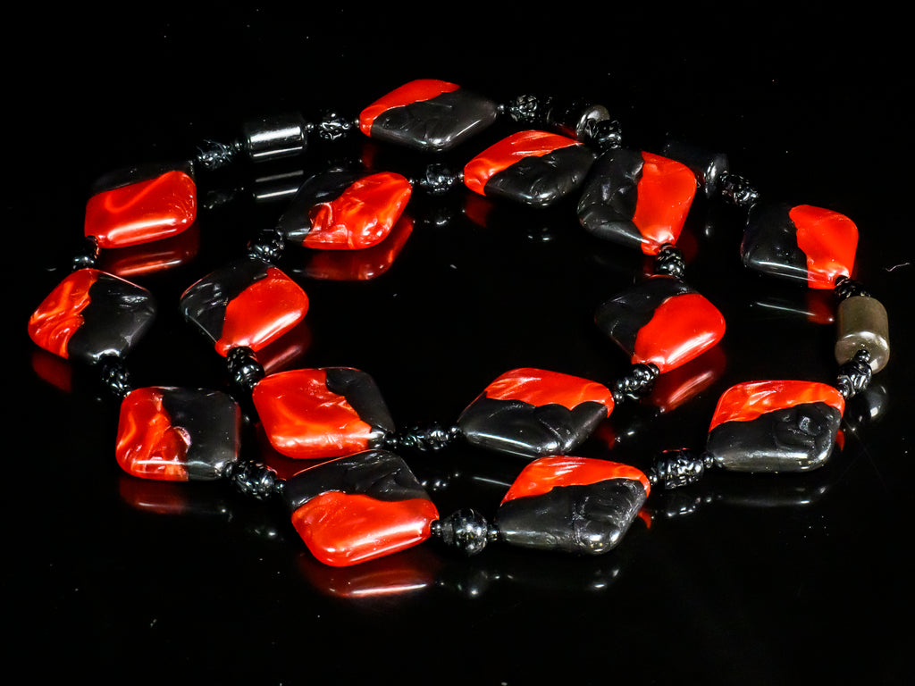 A Necklace in Black and Red of Lucite, Murano Glass, and Obsidian