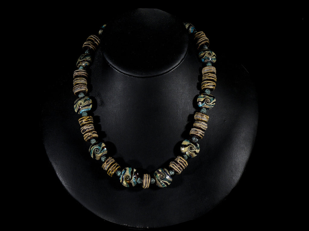 A Necklace of Murano Glass and Handmade Lampwork Designer Glass beads in Teal, Amethyst and Brown Tones