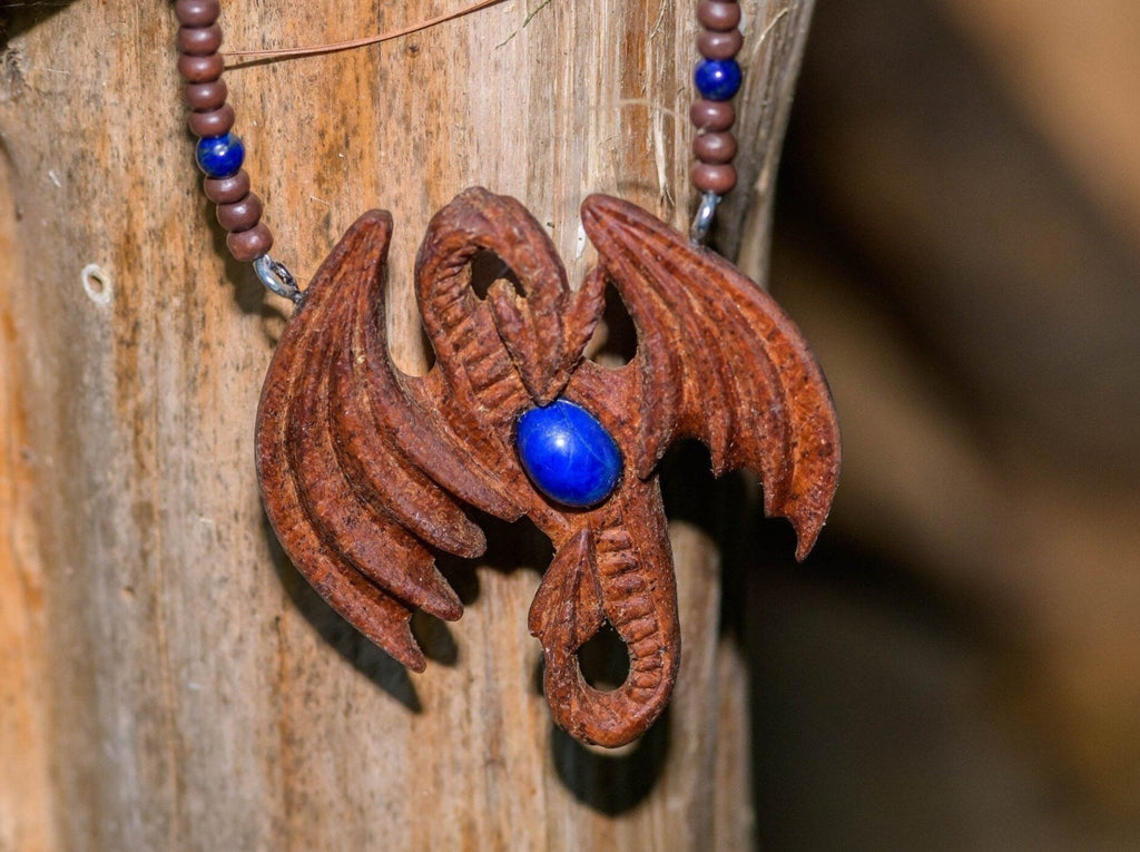 Hand-carved Dragon pendant of African Mahogany with genuine Lapis Lazuli on a wood and lapis lazuli necklace