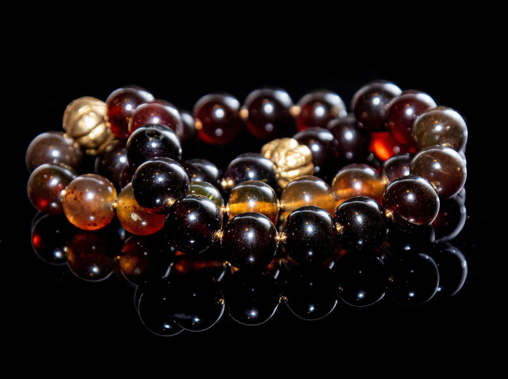 A Matiné Necklace of Indonesian Amber in Gold and Honey Hues