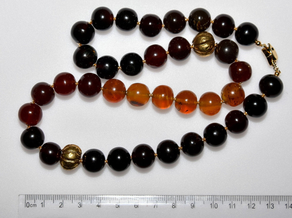 A Matiné Necklace of Indonesian Amber in Gold and Honey Hues