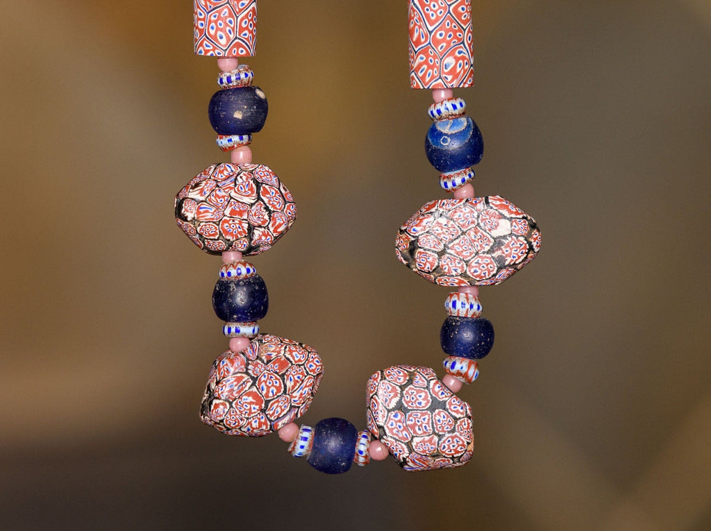 A Necklace of Antique African Trade Beads with Large Rare Millelfori, Awale, Dutch Dogon Beads, and Pink Antique Bohemian Round spacers.
