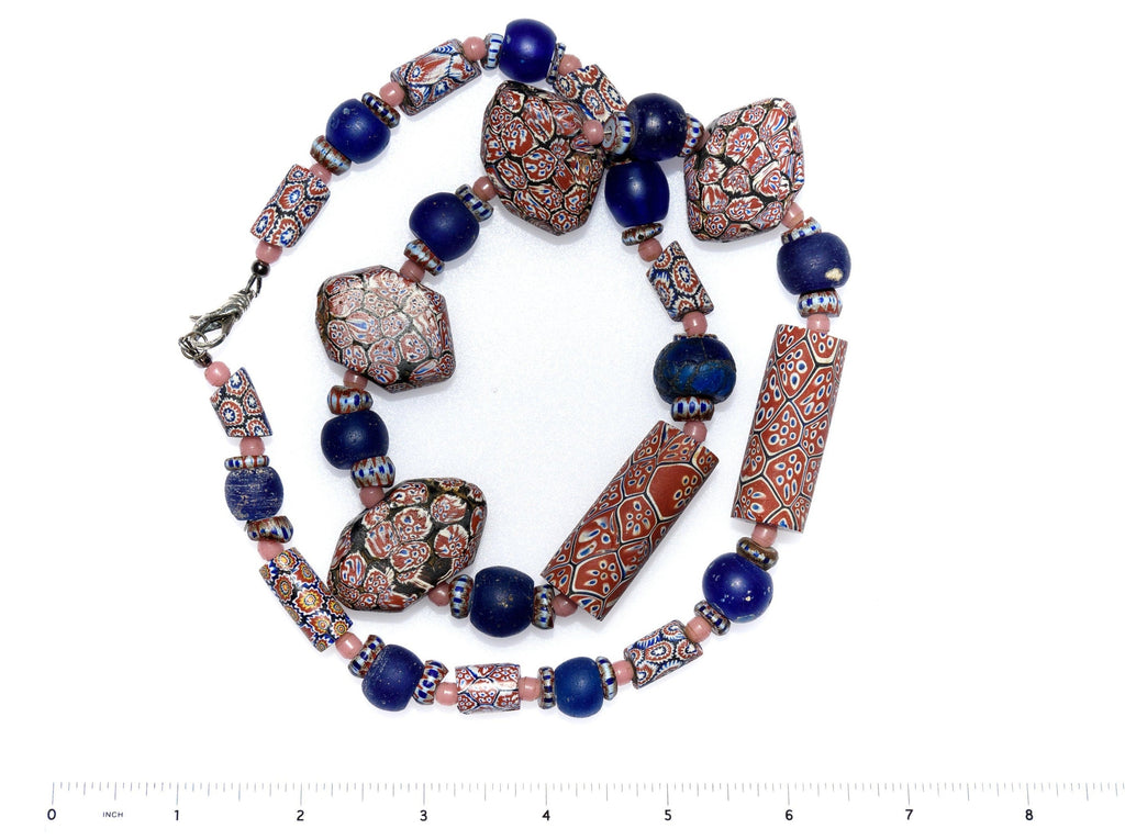 A Necklace of Antique African Trade Beads with Large Rare Millelfori, Awale, Dutch Dogon Beads, and Pink Antique Bohemian Round spacers.
