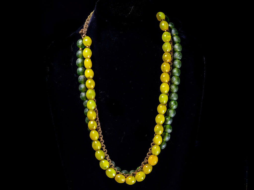 A Triple-strand Necklace of Antique yellow "tomato" Bohemian Trade beads, Krobo Recycled Glass,  and  African Brass