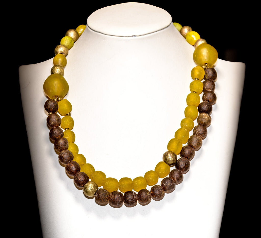 A Double-Strand Necklace of Krobo Glass, Antique Yellow "Tomato" Bohemian Trade Beads,  and Nigerian Brass Globe Beads