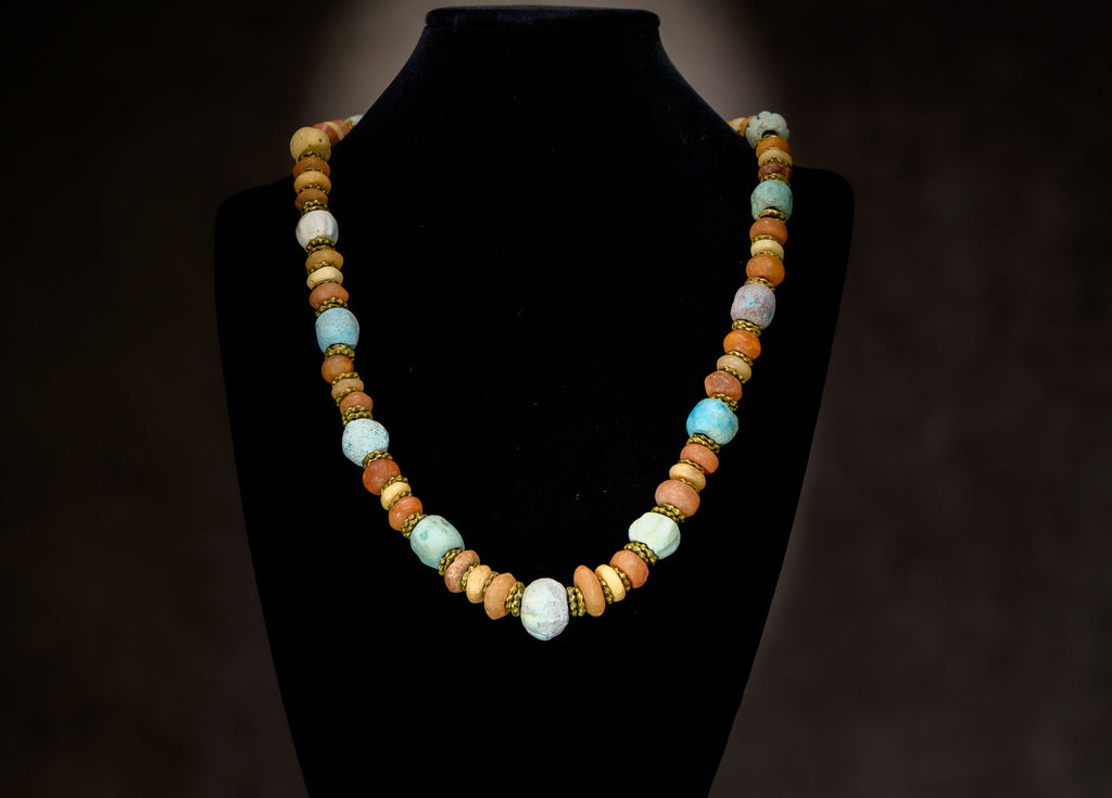 A Necklace of Ancient Persian Faience, Ancient Carnelian, and African Brass Aja Beads