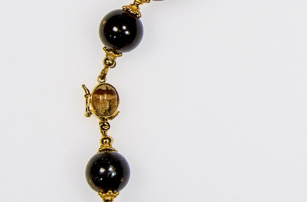 A Necklace of Rare Fushun Amber,  Columbian Copal and 18K Gold Vermeil (X10)