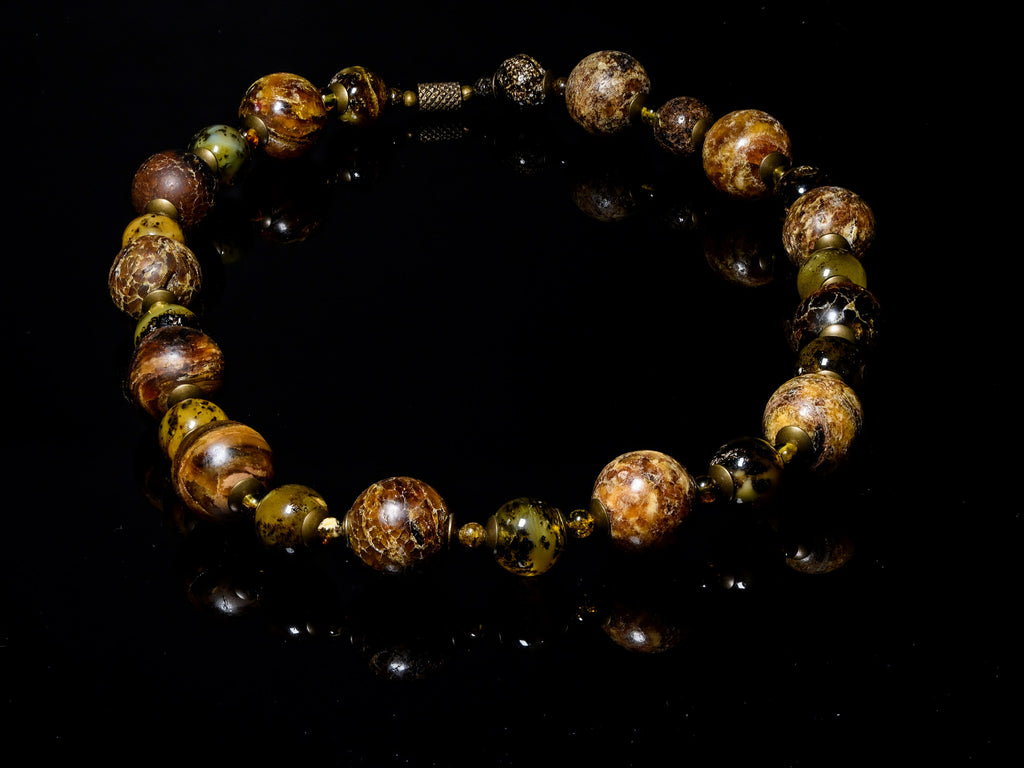 A Necklace of Baltic Green Amber and Columbian Copal (X11)