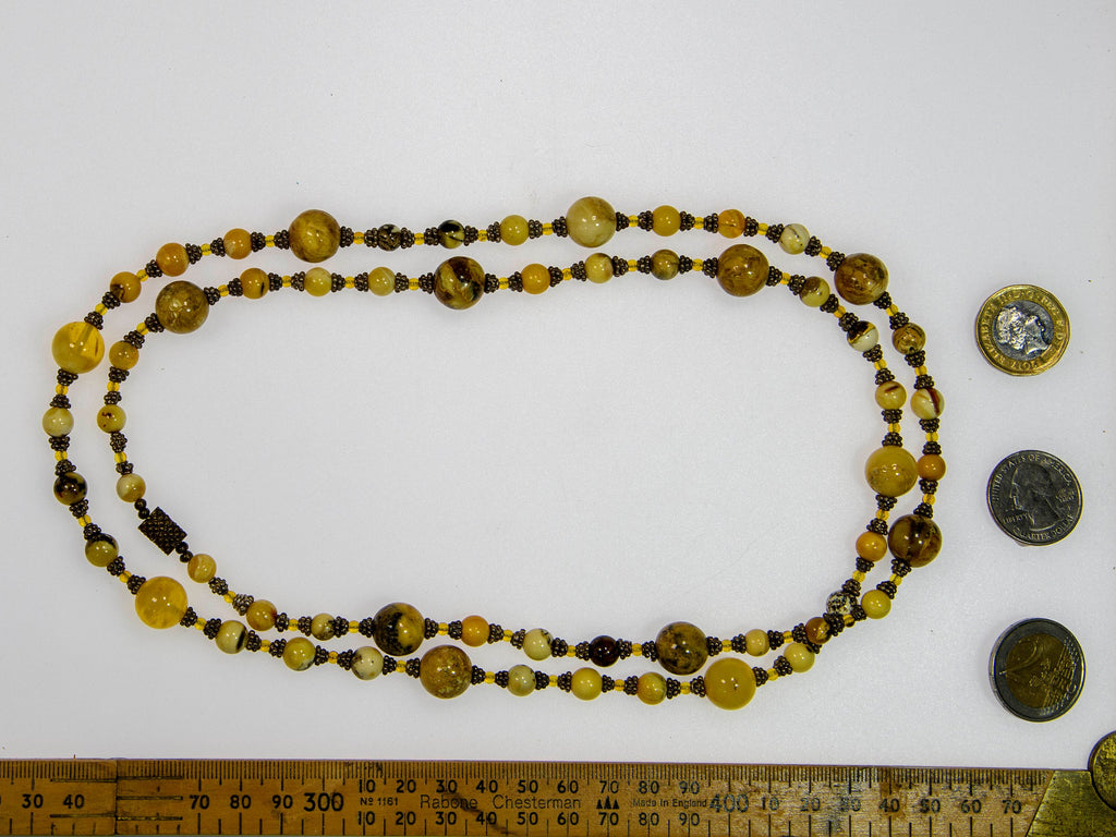 A Long Necklace of Baltic Amber and Sterling Silver (X14)