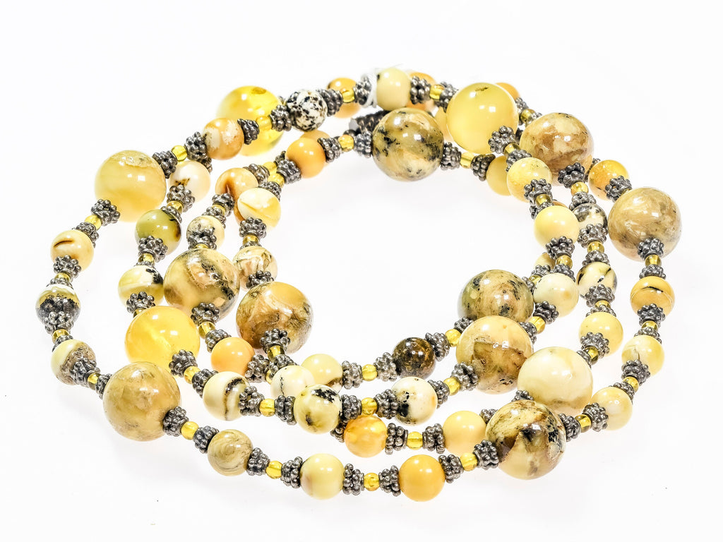 A Long Necklace of Baltic Amber and Sterling Silver (X14)